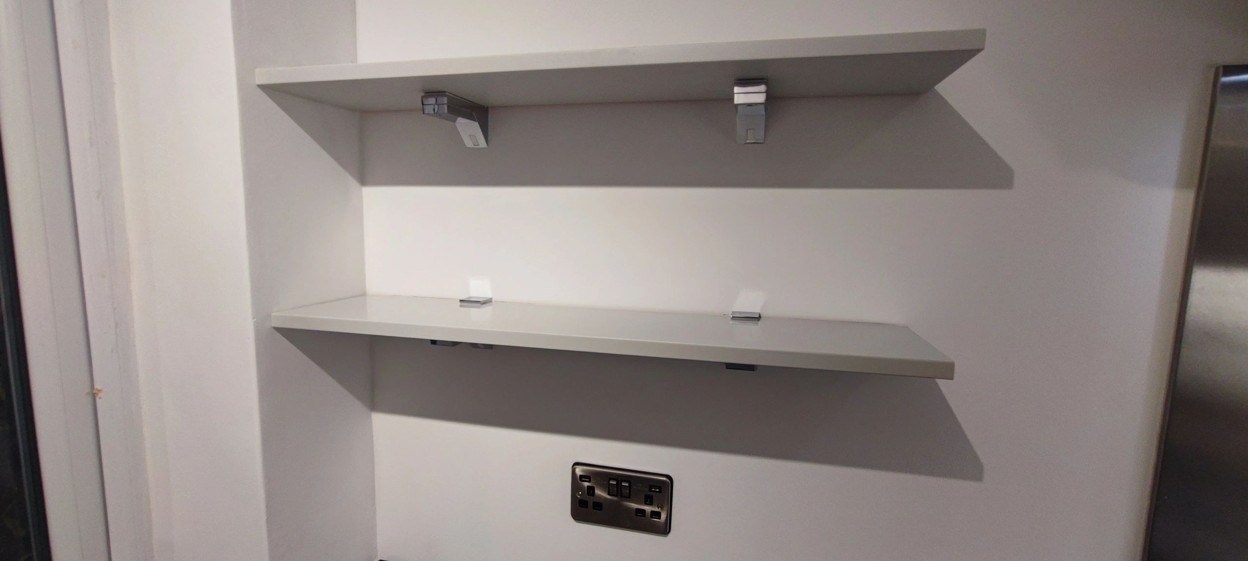 Floating shelves fitted above a kitchen worktop